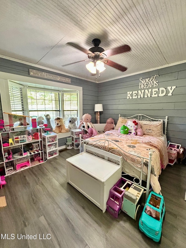 31019 N 19th Hwy, West, MS 39192 - bedroom with wooden walls, a ceiling fan, and wood finished floors