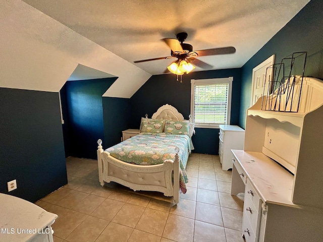 31019 N 19th Hwy, West, MS 39192 - bedroom with light tile patterned floors, a ceiling fan, a textured ceiling, and vaulted ceiling