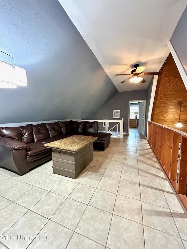 31019 N 19th Hwy, West, MS 39192 - living room with a ceiling fan, light tile patterned floors, and vaulted ceiling