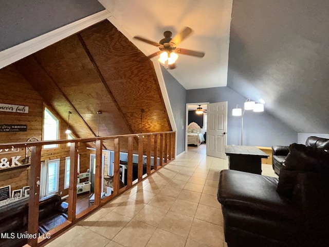 31019 N 19th Hwy, West, MS 39192 - additional living space with tile patterned floors, wooden walls, lofted ceiling, and ceiling fan