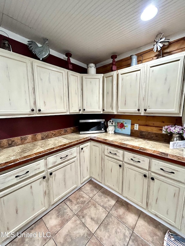 31019 N 19th Hwy, West, MS 39192 - kitchen featuring stainless steel microwave and light tile patterned flooring
