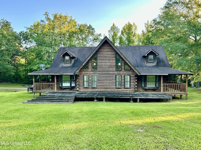 31019 N 19th Hwy, West, MS 39192 - rear view of house with a lawn, a porch, and log exterior