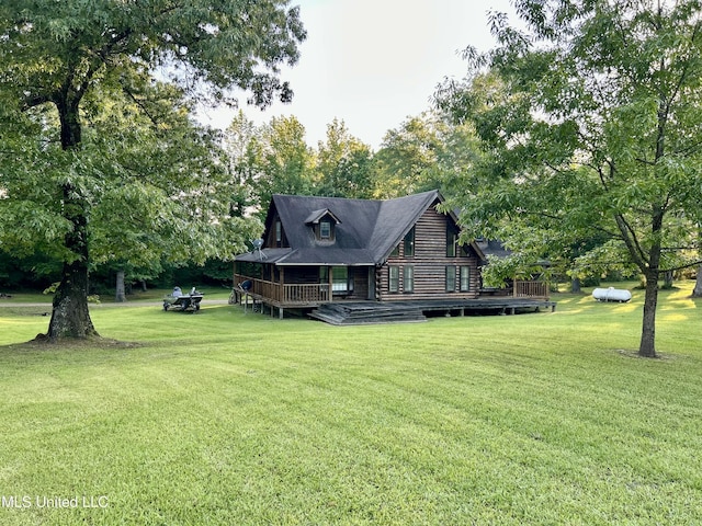 31019 N 19th Hwy, West, MS 39192 - rear view of property featuring a wooden deck and a lawn
