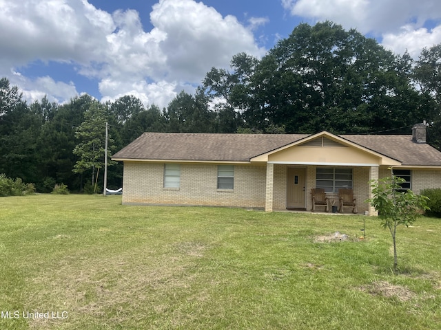 23601 Hinton Rd, Lucedale, MS 39452 - ranch-style house featuring brick siding, covered porch, a front lawn, and roof with shingles