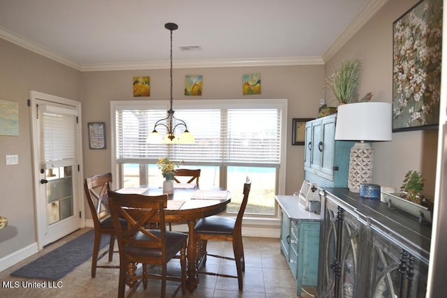 tiled dining room featuring a healthy amount of sunlight, visible vents, and ornamental molding