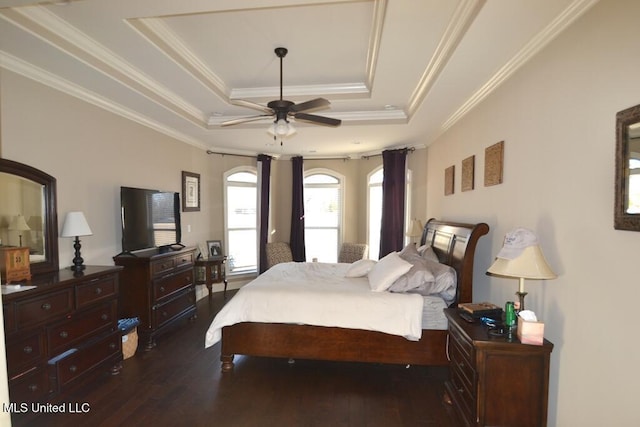 bedroom featuring ornamental molding, a raised ceiling, and dark wood-type flooring