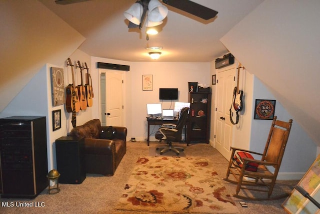 office area with a ceiling fan, light colored carpet, and baseboards