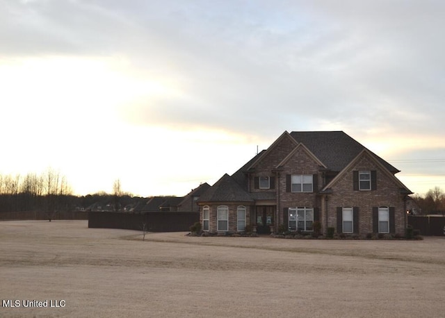 view of front of home with brick siding