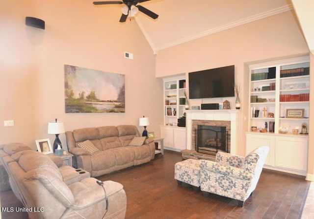 living room featuring dark wood-type flooring, visible vents, a fireplace, and a ceiling fan