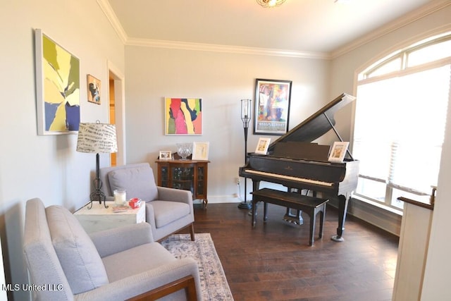 living area with baseboards, dark wood finished floors, and crown molding