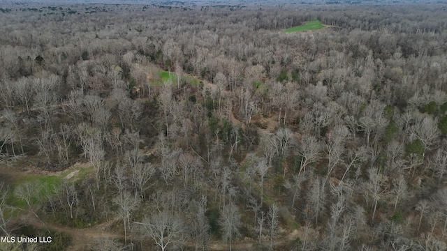 bird's eye view featuring a wooded view