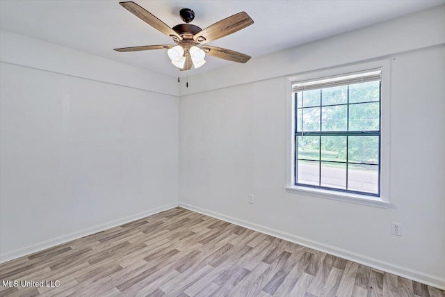 722 SE 1st St, Magee, MS 39111 - spare room with light wood-type flooring, a ceiling fan, and baseboards