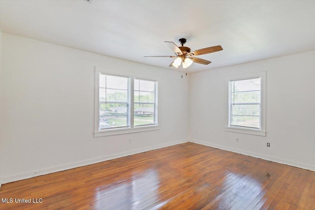 722 SE 1st St, Magee, MS 39111 - empty room with a ceiling fan, baseboards, and hardwood / wood-style floors