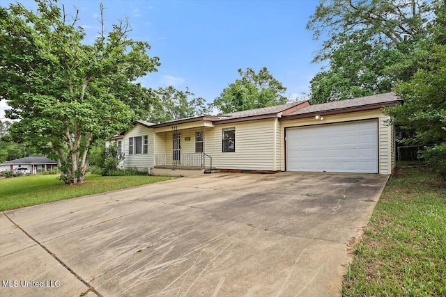 722 SE 1st St, Magee, MS 39111 - ranch-style home featuring a porch, a garage, a front yard, and concrete driveway