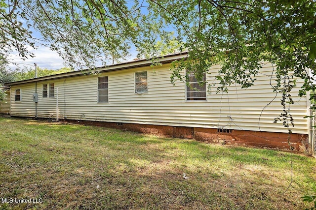 722 SE 1st St, Magee, MS 39111 - view of side of property featuring a lawn and crawl space