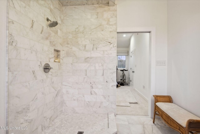 bathroom featuring a tile shower