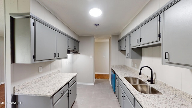 1384 Whitworth Cv, Southaven, MS 38671 - kitchen featuring a sink, gray cabinets, baseboards, light tile patterned flooring, and light stone countertops