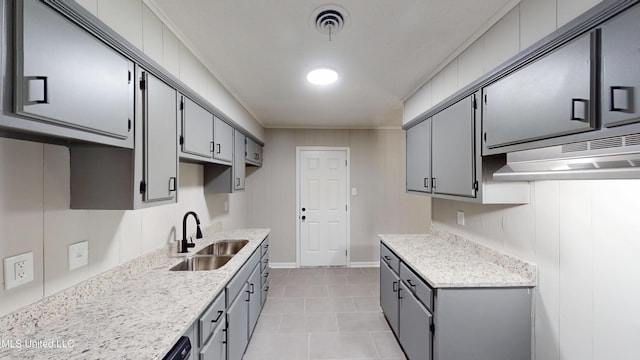 1384 Whitworth Cv, Southaven, MS 38671 - kitchen featuring a sink, gray cabinetry, ventilation hood, light tile patterned flooring, and baseboards