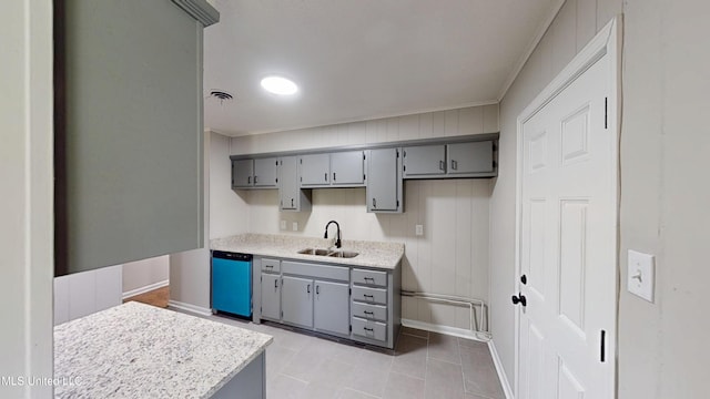 1384 Whitworth Cv, Southaven, MS 38671 - kitchen with gray cabinets, a sink, dishwasher, baseboards, and ornamental molding