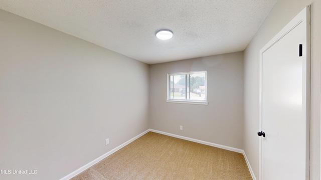 1384 Whitworth Cv, Southaven, MS 38671 - empty room with light carpet, baseboards, and a textured ceiling