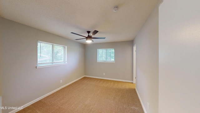 1384 Whitworth Cv, Southaven, MS 38671 - empty room with light colored carpet, ceiling fan, and baseboards