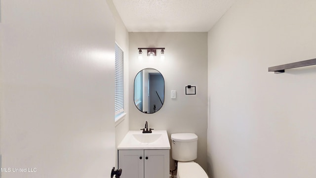 1384 Whitworth Cv, Southaven, MS 38671 - bathroom with toilet, vanity, and a textured ceiling