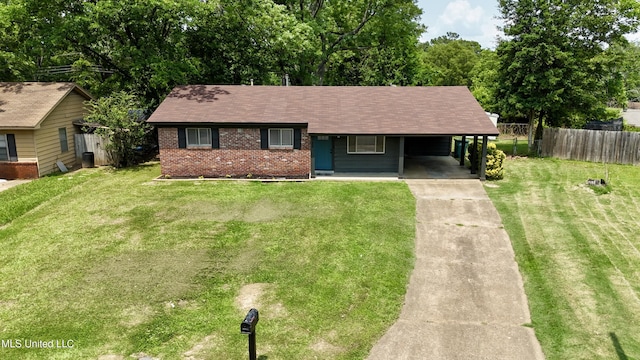 1384 Whitworth Cv, Southaven, MS 38671 - view of front facade with driveway, brick siding, an attached carport, and a shingled roof