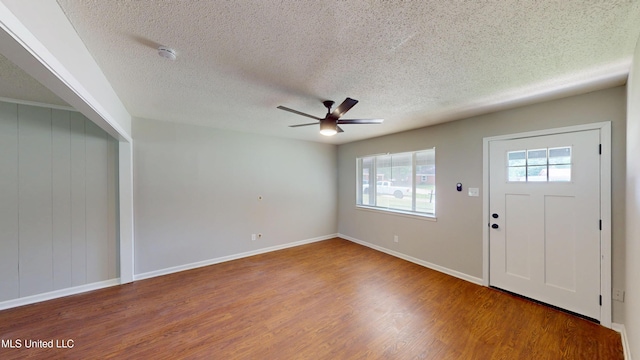 1384 Whitworth Cv, Southaven, MS 38671 - foyer entrance featuring healthy amount of natural light, wood finished floors, ceiling fan, a textured ceiling, and baseboards
