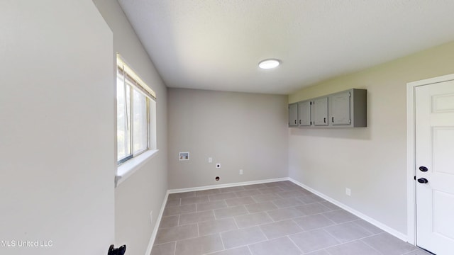 1384 Whitworth Cv, Southaven, MS 38671 - spare room featuring light tile patterned flooring and baseboards