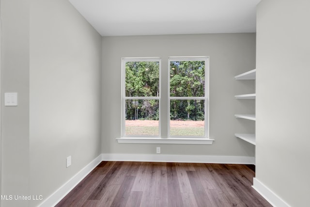 13379 Wash Fayard Rd, Biloxi, MS 39532 - empty room with dark wood-style flooring and baseboards