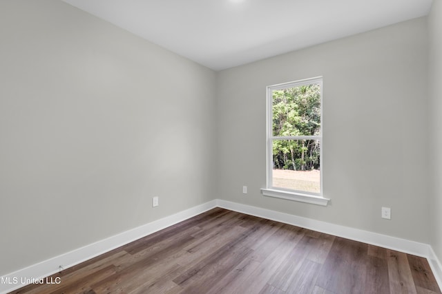 13379 Wash Fayard Rd, Biloxi, MS 39532 - empty room with baseboards and dark wood finished floors