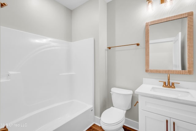 13379 Wash Fayard Rd, Biloxi, MS 39532 - full bath featuring vanity, toilet, baseboards, shower / bathtub combination, and wood finished floors