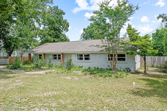 back of house featuring a lawn