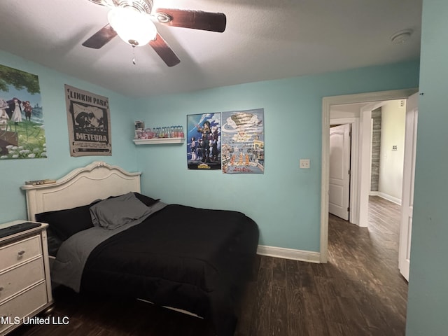 9612 Kini St, Diamondhead, MS 39525 - bedroom with dark wood-style floors and ceiling fan