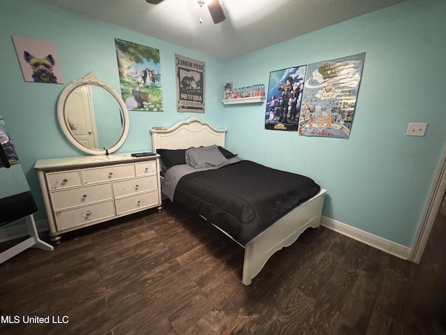 9612 Kini St, Diamondhead, MS 39525 - bedroom featuring dark wood-style floors and ceiling fan