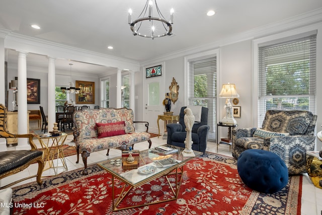 tiled living room featuring a notable chandelier, plenty of natural light, and decorative columns