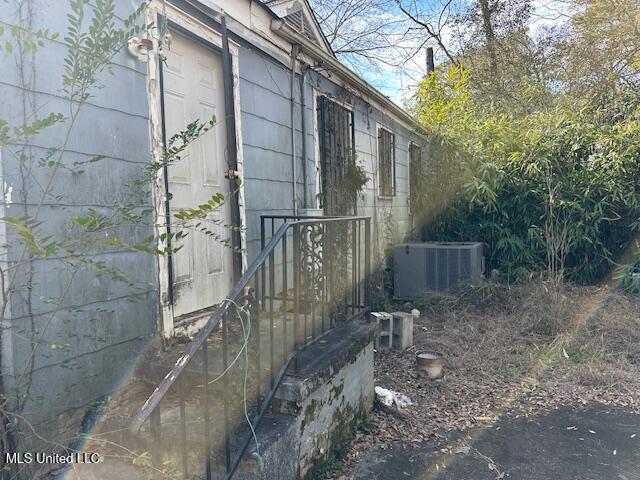 view of side of home with cooling unit