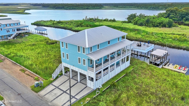 birds eye view of property featuring a water view