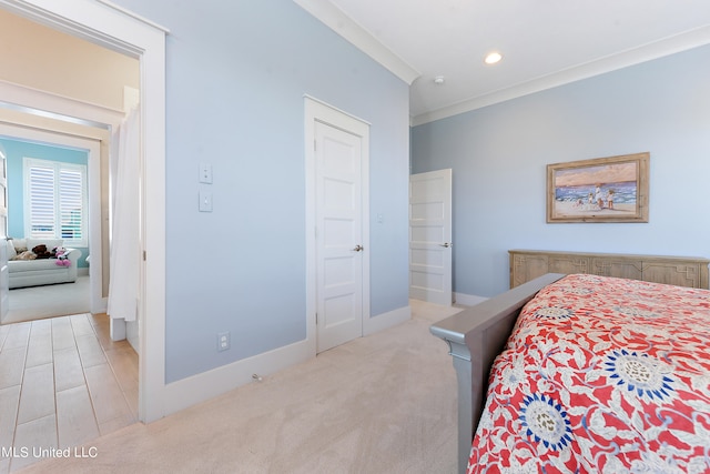 carpeted bedroom with crown molding