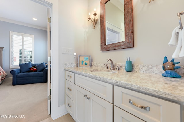 bathroom featuring vanity and crown molding