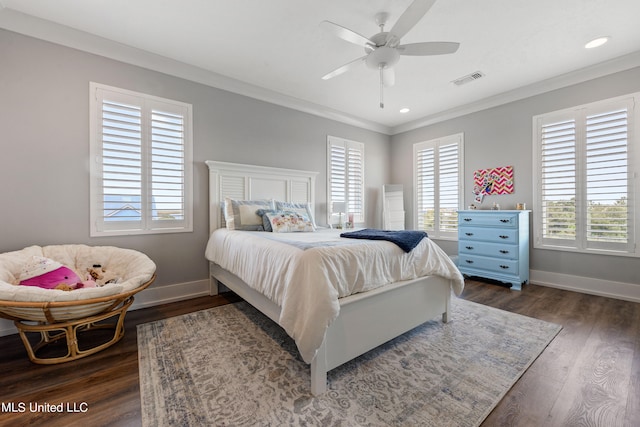 bedroom featuring crown molding, dark hardwood / wood-style floors, and ceiling fan