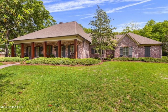 100 Stonebridge Dr, Madison, MS 39110 - view of front of house featuring a front yard, brick siding, a porch, and roof with shingles
