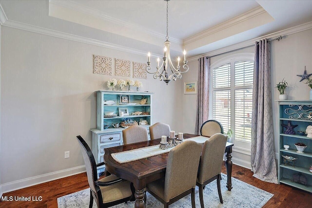 38 Savannah Cir, Brandon, MS 39047 - dining space with a chandelier, a tray ceiling, ornamental molding, and dark wood finished floors