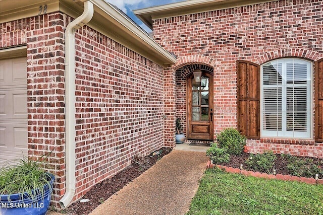 38 Savannah Cir, Brandon, MS 39047 - view of exterior entry featuring brick siding and a garage