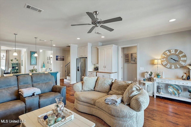 38 Savannah Cir, Brandon, MS 39047 - living area featuring dark wood-style floors, a ceiling fan, stairs, ornamental molding, and recessed lighting