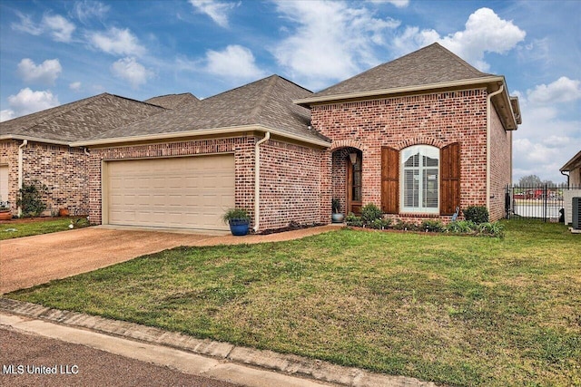 38 Savannah Cir, Brandon, MS 39047 - french country style house with brick siding, an attached garage, roof with shingles, and driveway