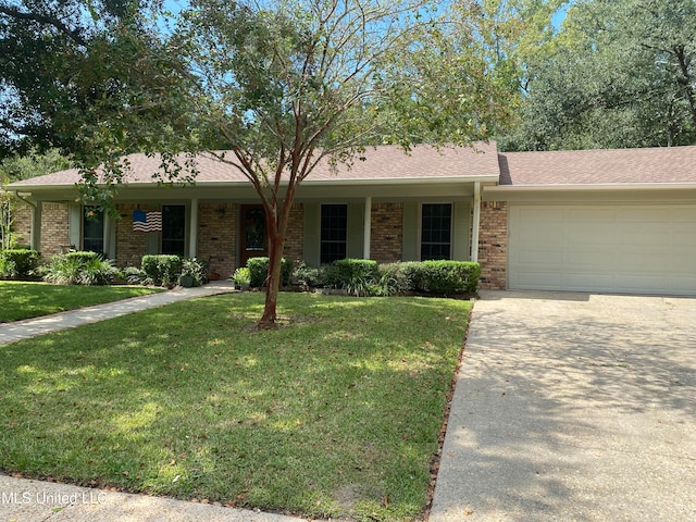 single story home with a front yard and a garage