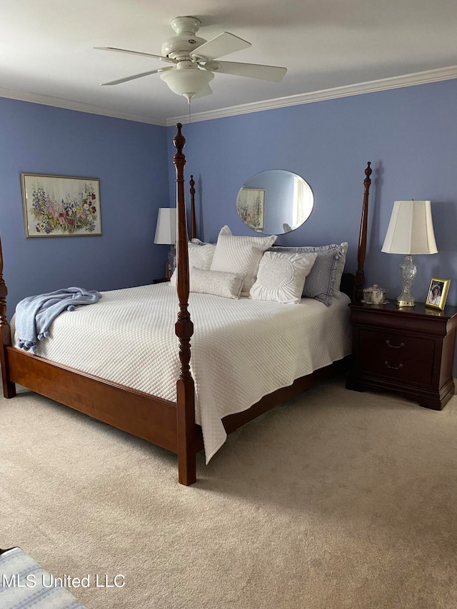 carpeted bedroom with crown molding and ceiling fan