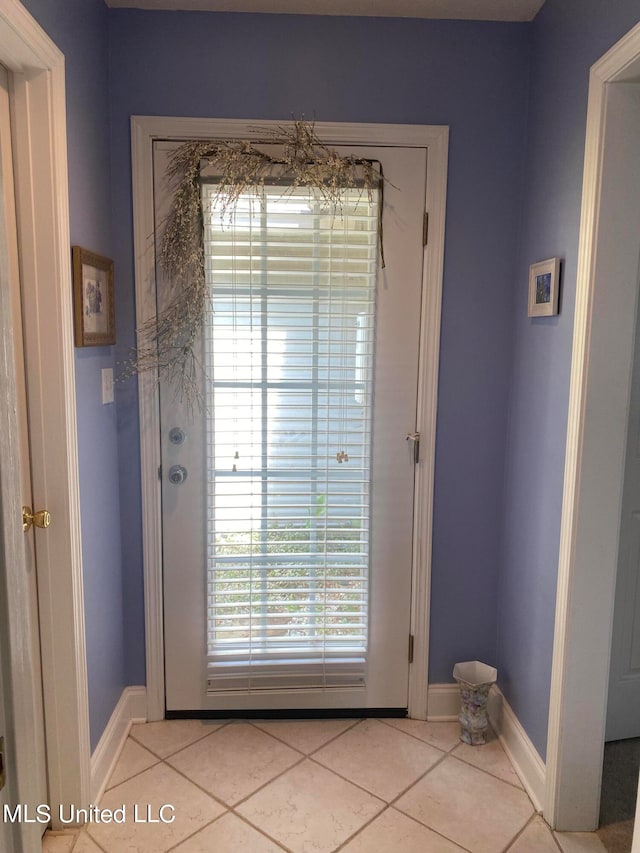 entryway featuring light tile patterned flooring