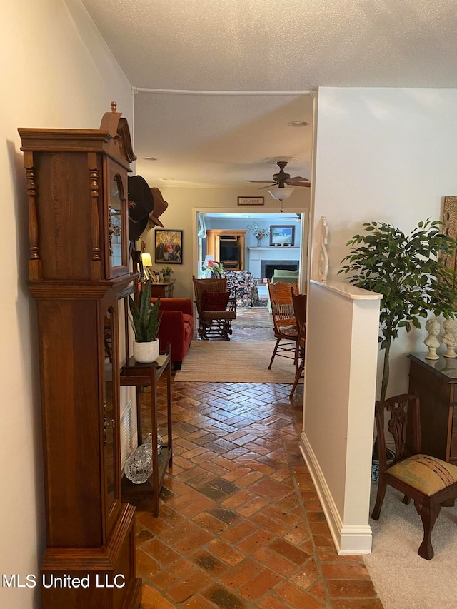 hallway featuring a textured ceiling